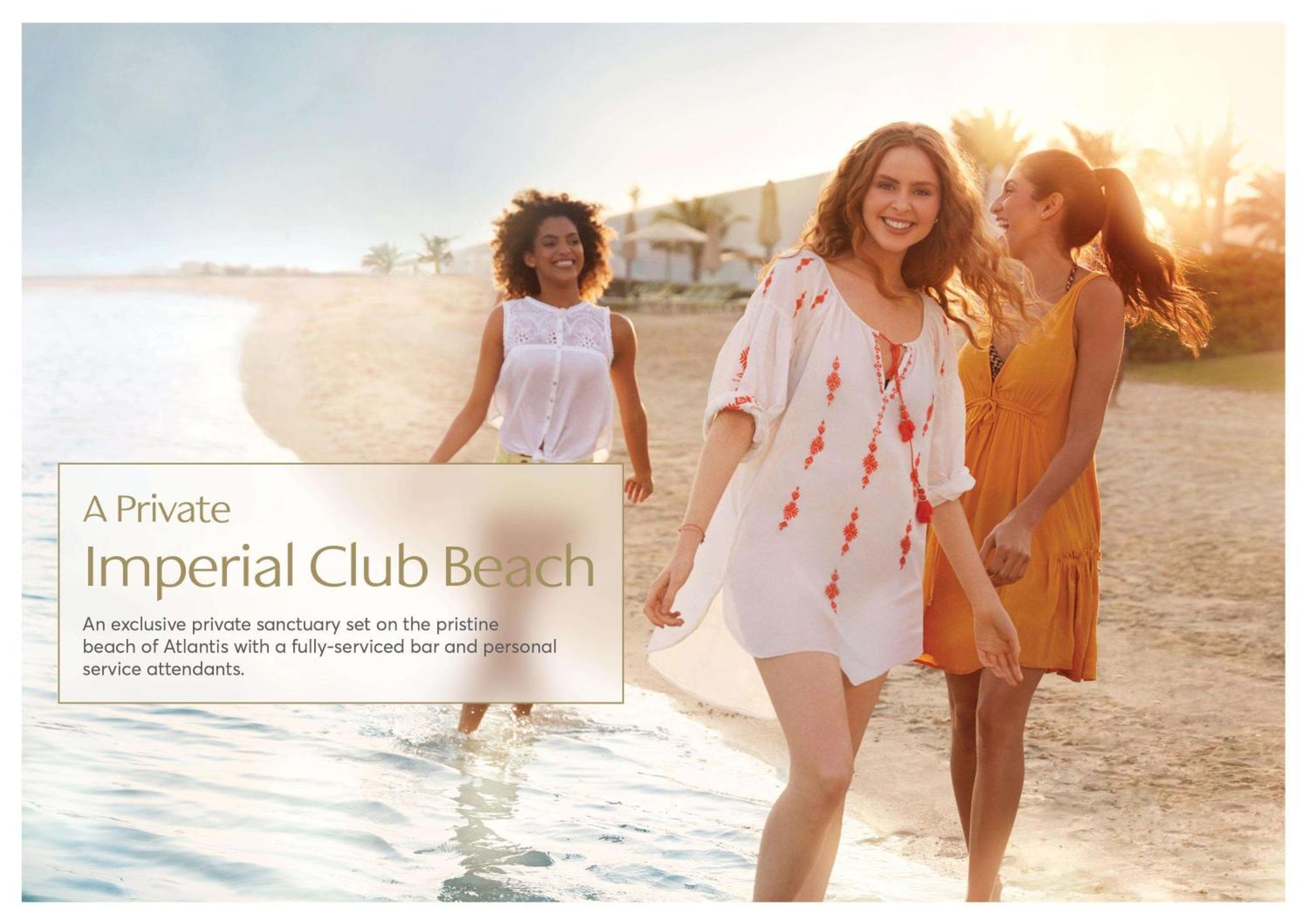 Hotel Atlantis, The Palm Dubai Esterno foto The photo showcases a serene beach scene featuring three women walking along the shoreline. They are dressed in light, summery outfits, exuding a relaxed and joyful vibe. The background reveals a beautiful sandy beach with palm trees, suggesting a tr