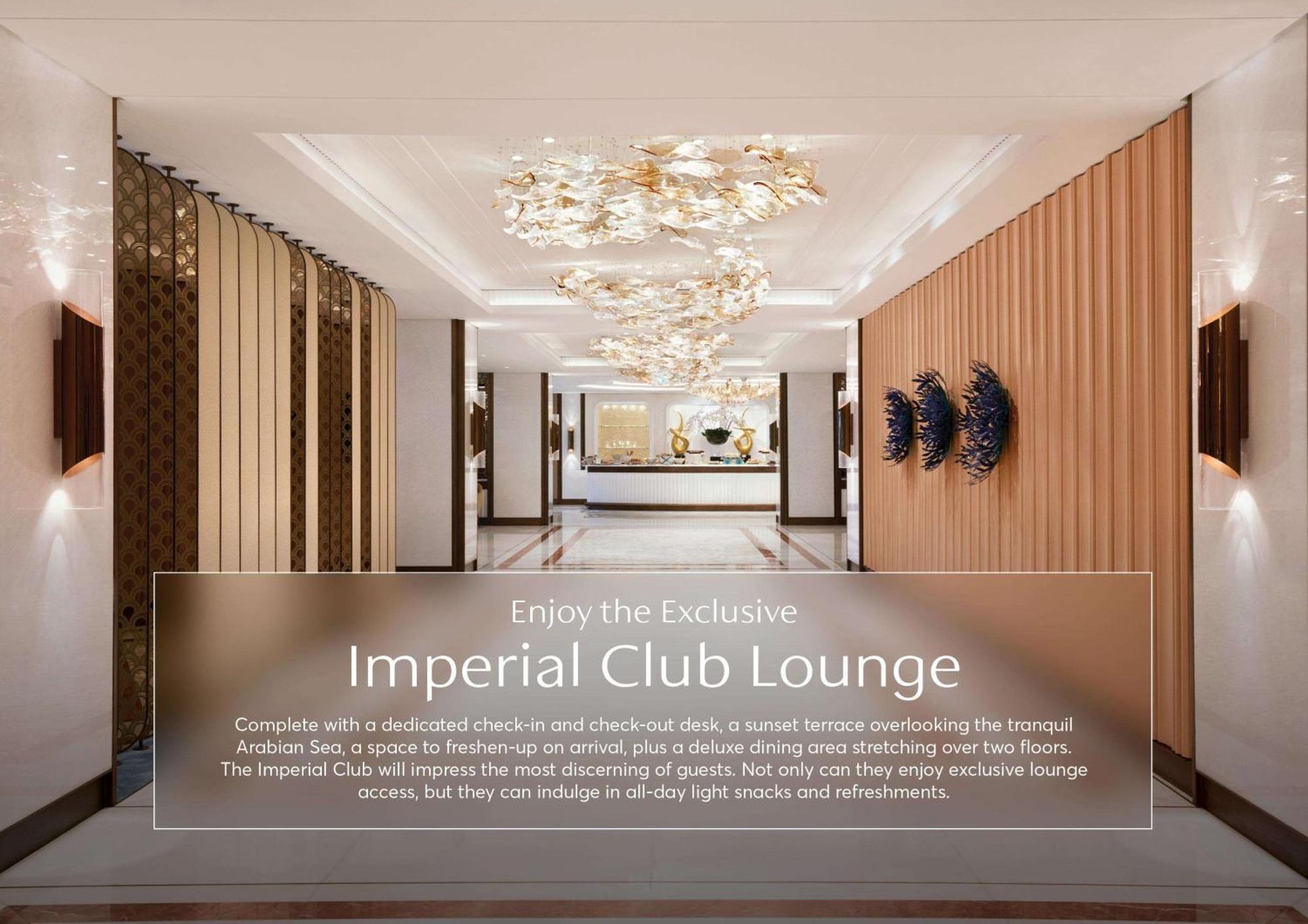 Hotel Atlantis, The Palm Dubai Esterno foto The image features an interior space of a luxurious lounge, referred to as the "Imperial Club Lounge." The lounge is designed with elegant decor, including modern lighting fixtures that resemble elaborate chandeliers. The walls are a combination of w
